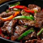 Sizzling Pepper Steak with Onions