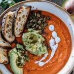 Roasted Tomato & Red Lentil Soup With Spicy Pepitas & Avocado Cream