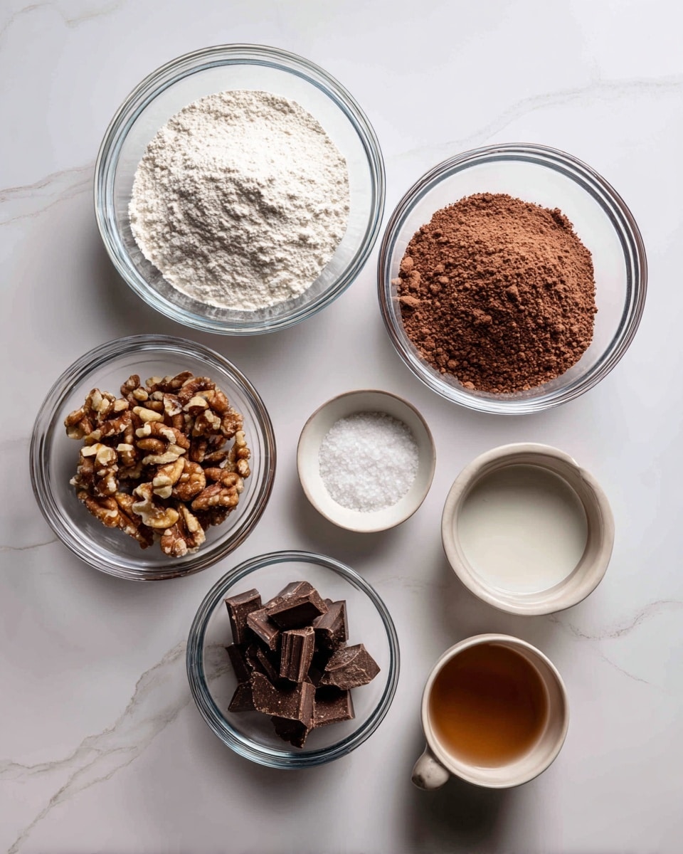 The image shows seven clear glass bowls placed on a white marbled surface. The largest bowl on the left holds a fine white powder. To its right, a medium bowl contains a reddish-brown powder mixed with some dry ingredients underneath. Above these, a smaller bowl is filled with chopped nuts that are brown with lighter pieces. Near the center, a very small bowl holds a white grainy substance, likely salt. Below this is a small bowl with a dark brown ingredient, possibly chopped chocolate chunks. A tiny dish with a light brown liquid sits nearby. The setup is neat and evenly spaced, capturing the dry and liquid baking ingredients before mixing, photo taken with an iphone --ar 4:5 --v 7