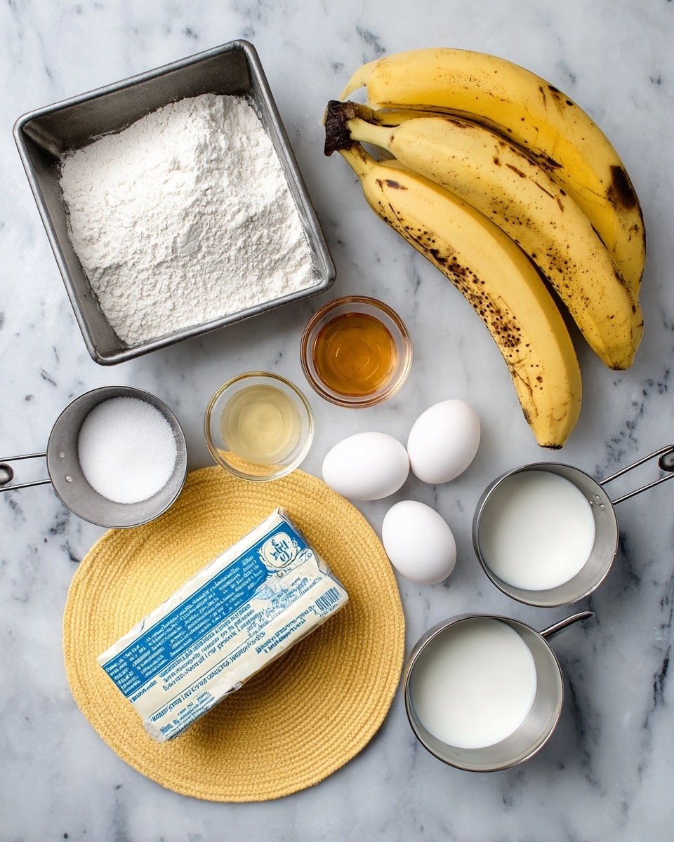 A top view of baking ingredients arranged on a white marbled surface, including a metal baking pan on the top left, a metal cup filled with white flour near the center, and three yellow bananas with brown spots placed to the right. Below the flour, on a round yellow textured mat, there are three white eggs. A rectangular stick of butter wrapped in silver foil with blue text is placed diagonally near the bottom left. Small glass bowls hold honey and baking soda, while metal measuring cups next to them contain white sugar and milk, positioned near the bottom right of the image. The arrangement is neat and evenly spaced photo taken with an iphone --ar 4:5 --v 7