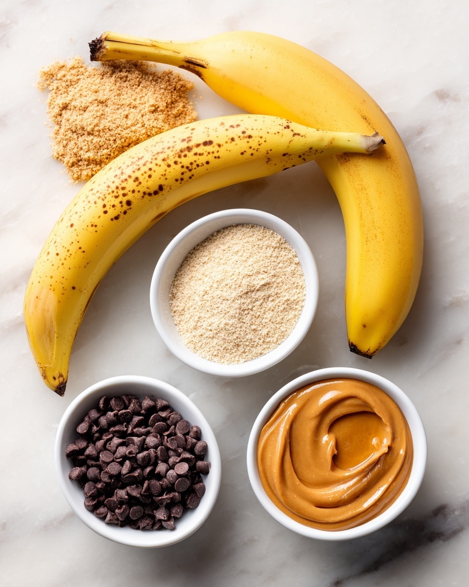 Two bananas lie next to each other on a white marbled surface, one bright yellow and the other yellow with brown spots. Nearby, there are four small white bowls arranged in a loose square shape. The top left bowl holds light tan peanut butter powder with a crumbly texture, while the top right bowl contains pale almond flour, also crumbly but slightly finer. The bottom left bowl is filled with small dark brown chocolate chips that look smooth and glossy. The bottom right bowl holds thick, creamy peanut butter with a few drips and a rich, orange-brown color. photo taken with an iphone --ar 4:5 --v 7