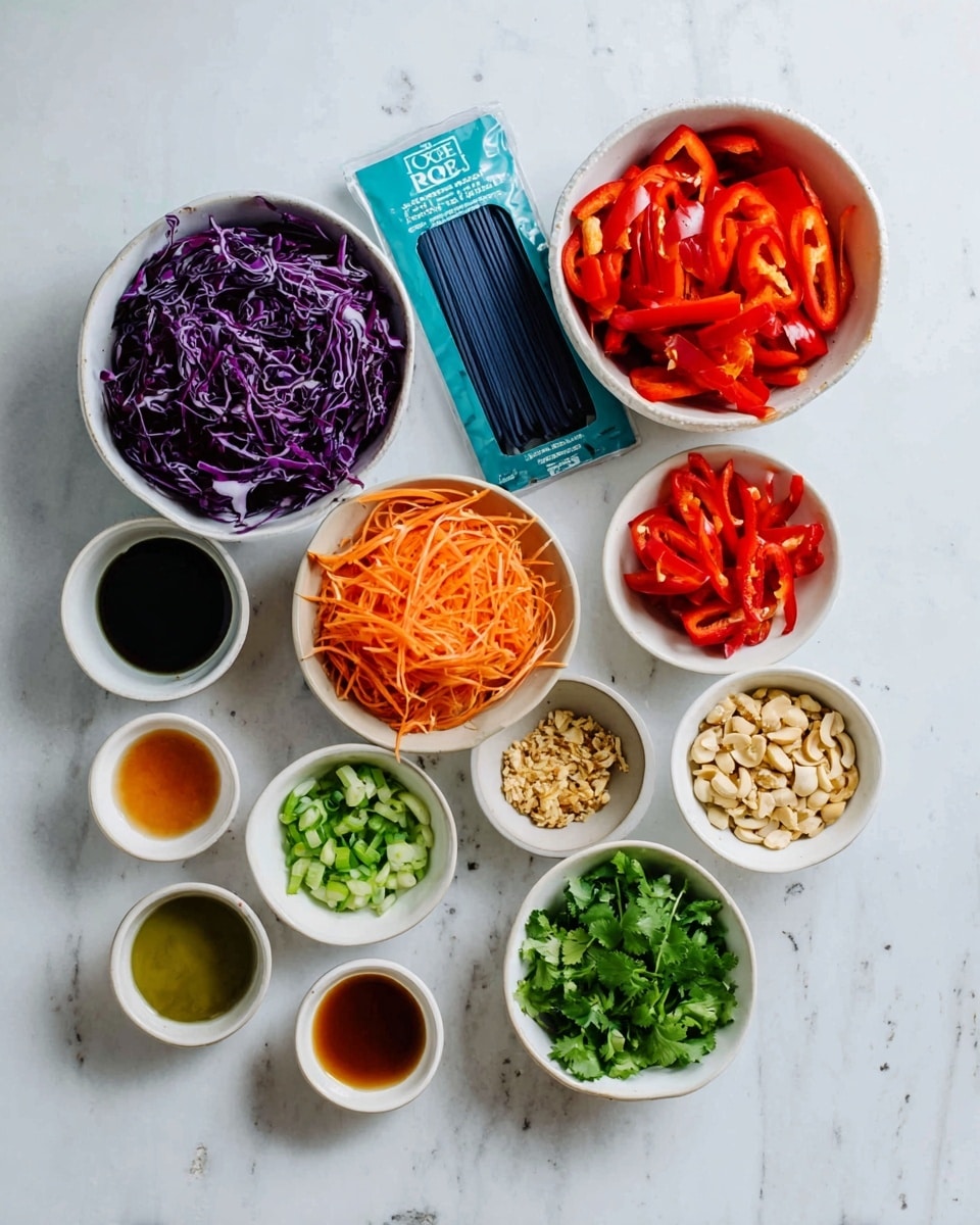 A flat lay photo on a white marbled surface shows an arrangement of ingredients for a meal. In the center, there is a white bowl filled with thinly sliced deep purple cabbage, and above it, a white bowl filled with bright red sliced bell peppers next to another white bowl with shredded orange carrots. A packet of blue udon rice noodles sits between these bowls. To the right, there are four small white bowls with chopped green onions, fresh green cilantro, sliced red chili peppers, and light brown chopped nuts. On the left side, six small white bowls hold various condiments including a greenish oil, dark soy sauce, orange sauce, light brown sauce, minced garlic, and a small amount of red sauce. The image composition is clean, colorful, and organized. Photo taken with an iphone --ar 4:5 --v 7