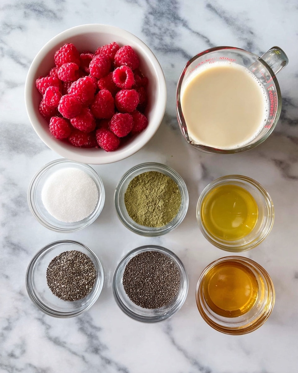 A top view of several ingredients on a white marbled surface: a white bowl filled with bright red raspberries at the top left, a glass measuring cup with creamy light beige liquid next to it on the top right, below them three small clear glass bowls in a row from left to right containing white sugar, green matcha powder, and dark chia seeds, and at the bottom a row of four small clear glass bowls with dark brown vanilla extract, light yellow lemon juice, white salt, and golden honey from left to right photo taken with an iphone --ar 4:5 --v 7